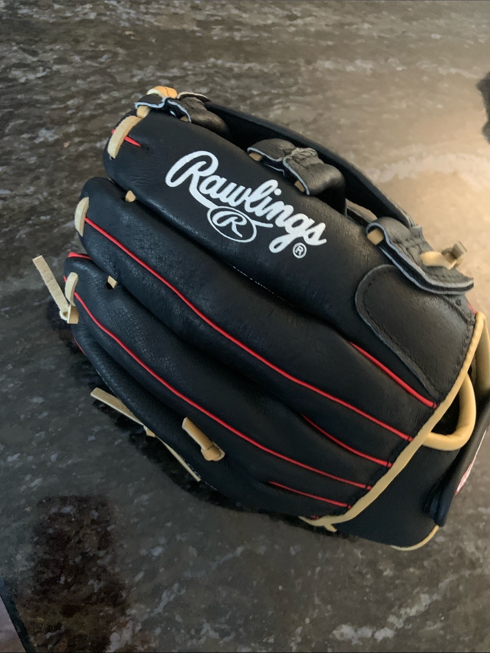 Rawlings Black Baseball Glove with Tan Lacing and Red Piping
